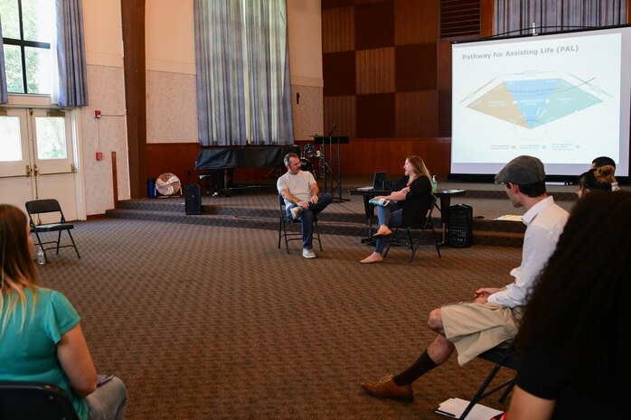 The trainees of the Applied Suicide Intervention Skills Training (ASIST) gather in a group discussion in the base chapel at Beale Air Force Base, Calif. on Sept. 22, 2022