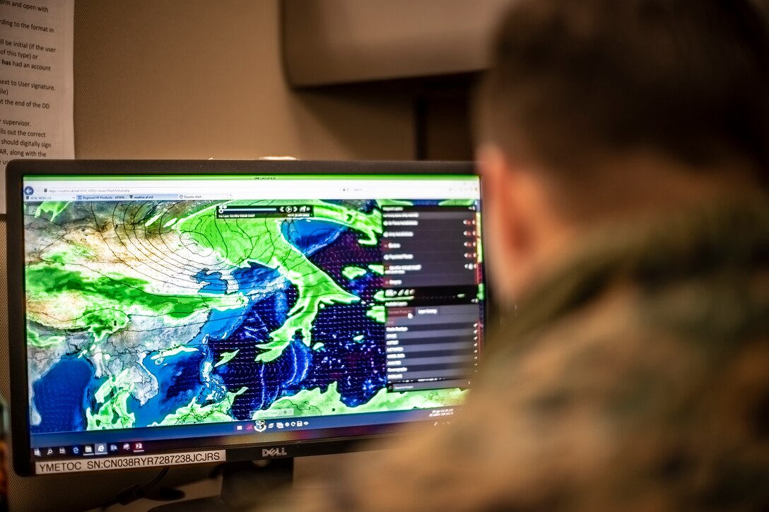 A computer screen shows swirls of weather patterns over a geographic area.