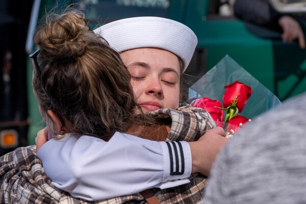 NORFOLK (Sept. 28, 2022) A Sailor, assigned to the Arleigh Burke-class destroyer USS Gonzalez (DDG 66), embraces a family member upon returning to Naval Station Norfolk after a regularly scheduled deployment in the U.S. 5th Fleet and U.S. 6th Fleet areas of operations, Sept. 28. Gonzelez  was deployed as part of the Harry S. Truman Carrier Strike Group in support of theater security cooperation efforts and to defend U.S., allied and partner interests. (U.S. Navy photo by Mass Communication 2nd Class Nathan T. Beard)