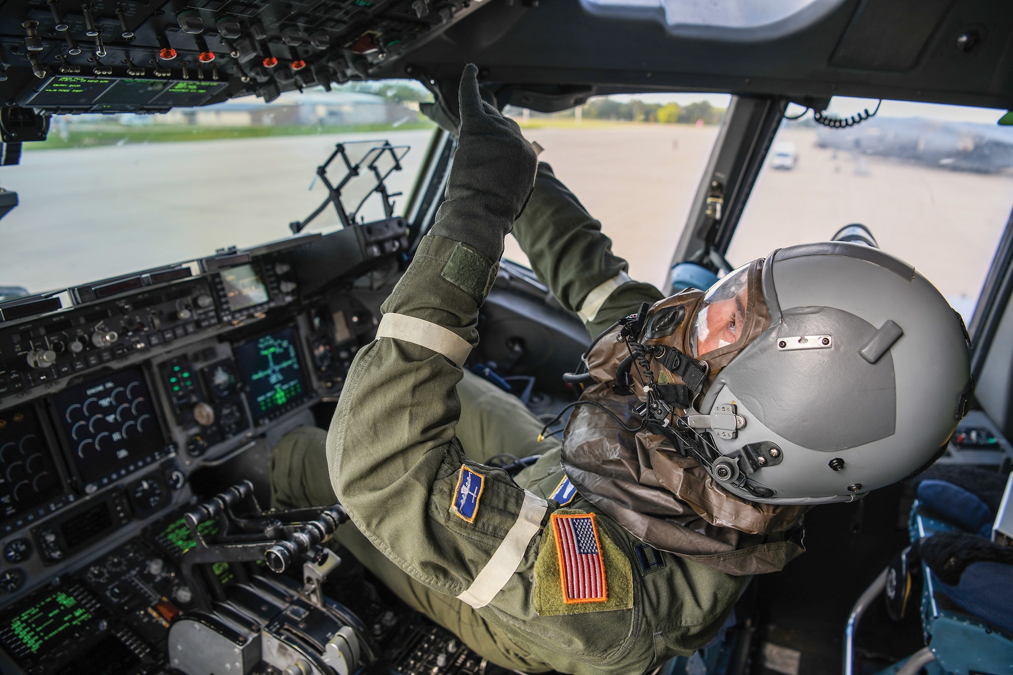 Capt. Trevor Tomlin, 89th Airlift Squadron C-17 pilot, performs a pre-flight check while wearing Mission Oriented Protective Posture (MOPP) gear, Sept. 13, 2022, while participating in Operation Merciful Valkyrie. More than 180 Airmen from the 445th Airlift Wing and members of the 5th Battalion, 159th Regiment General Support Aviation Battalion, Fort Knox, Kentucky, participated in an aeromedical patient movement exercise named Operation Merciful Valkyrie, Sept. 11-14, 2022.