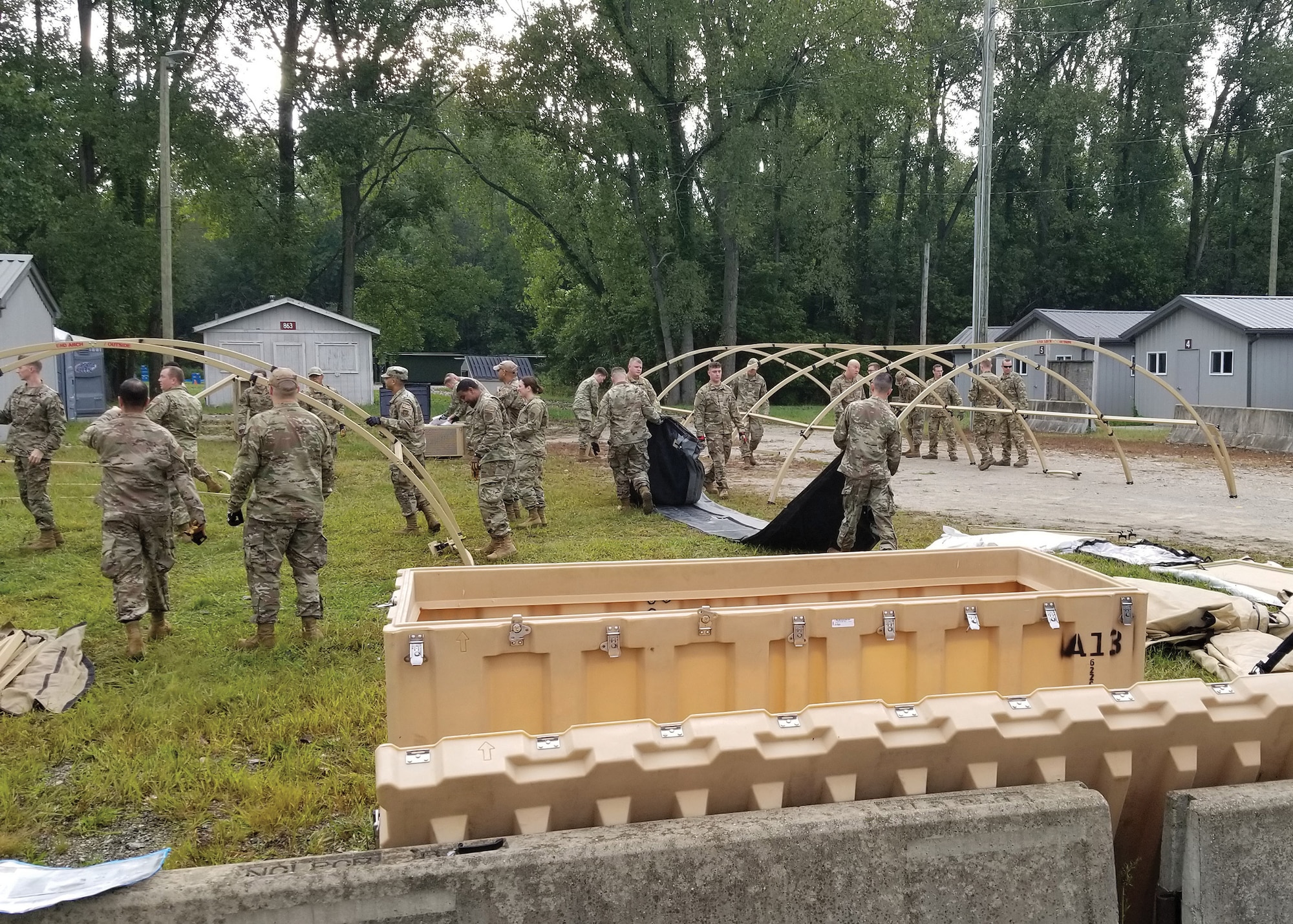 Airmen from the 445th Civil Engineer Squadron erect a small scale tent city to simulate operations in a bare-base environment during a field training exercise at the Wright-Patterson Air Force Base Warfighter Training Center, Sept. 8, 2022.