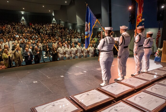 The Naval Medicine Readiness and Training Command Color Guard present colors during the Puget Sound Naval Shipyard & Intermediate Maintenance Facility Apprentice Program graduation ceremony held Sept. 23, 2022, at the Bremerton High School Performing Arts Center, in Bremerton, Wash.  (U.S. Navy Photo by Wendy Hallmark)