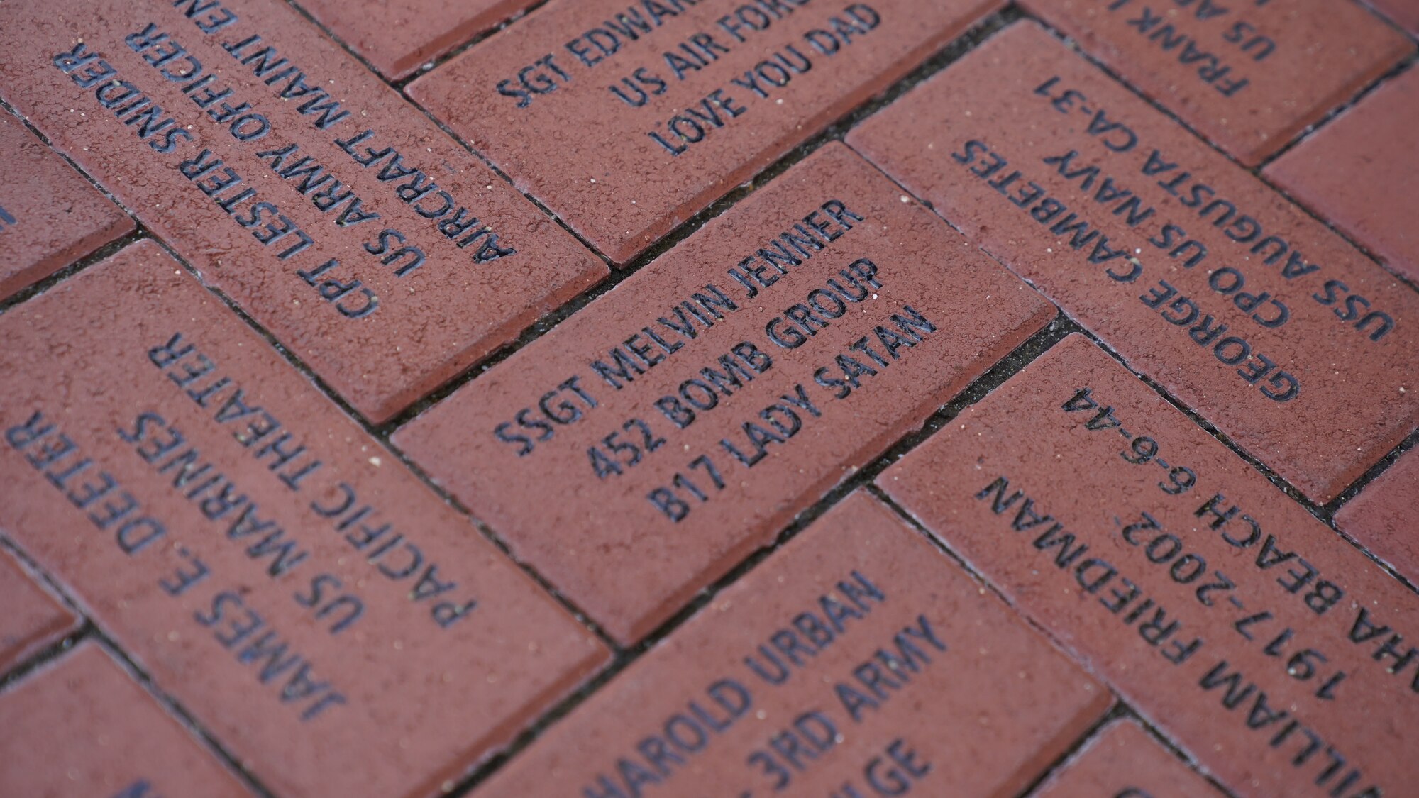 A commemorative brick for retired U.S. Army Air Forces Chief Master Sgt. Mel Jenner, 452nd Bomber Group radio operator, is displayed outside at the National World War II Museum, New Orleans, Louisiana, Sept. 14, 2022. Jenner’s first wife had purchased the commemorative brick to honor his military service. (U.S. Air Force photo by Airman 1st Class Elizabeth Davis)