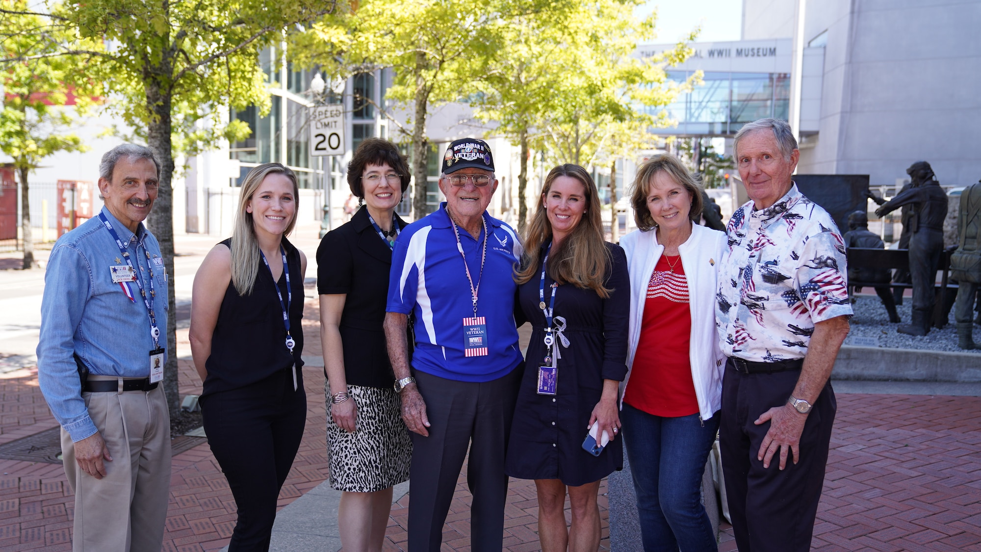 Retired U.S. Army Air Forces Chief Master Sgt. Mel Jenner, 452nd Bomber Group radio operator, stands with National World War II Museum staff and two family friends outside the National WWII Museum, New Orleans, Louisiana, Sept. 14, 2022. Jenner began his 26 year military career by training as a radio operator at what was then known as Keesler Army Airfield. (U.S. Air Force photo by Airman 1st Class Elizabeth Davis)