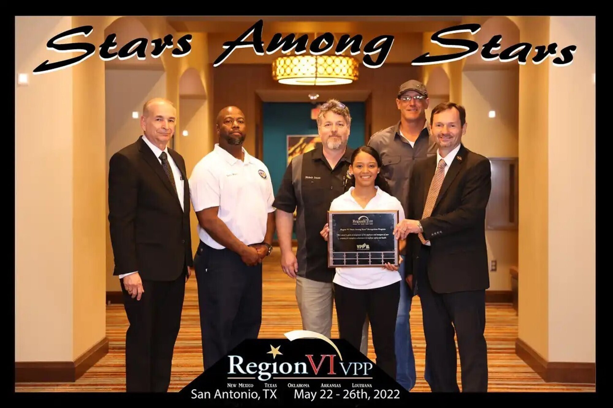 Representatives from the 97th Maintenance Group accept the Star Among Stars award in San Antonio, Texas, May 25, 2022. The award recognizes Volunteer Protection Program sites that have gone above and beyond to prevent and reduce workplace mishaps in a calendar year. (Courtesy photo by Gregory Miller)