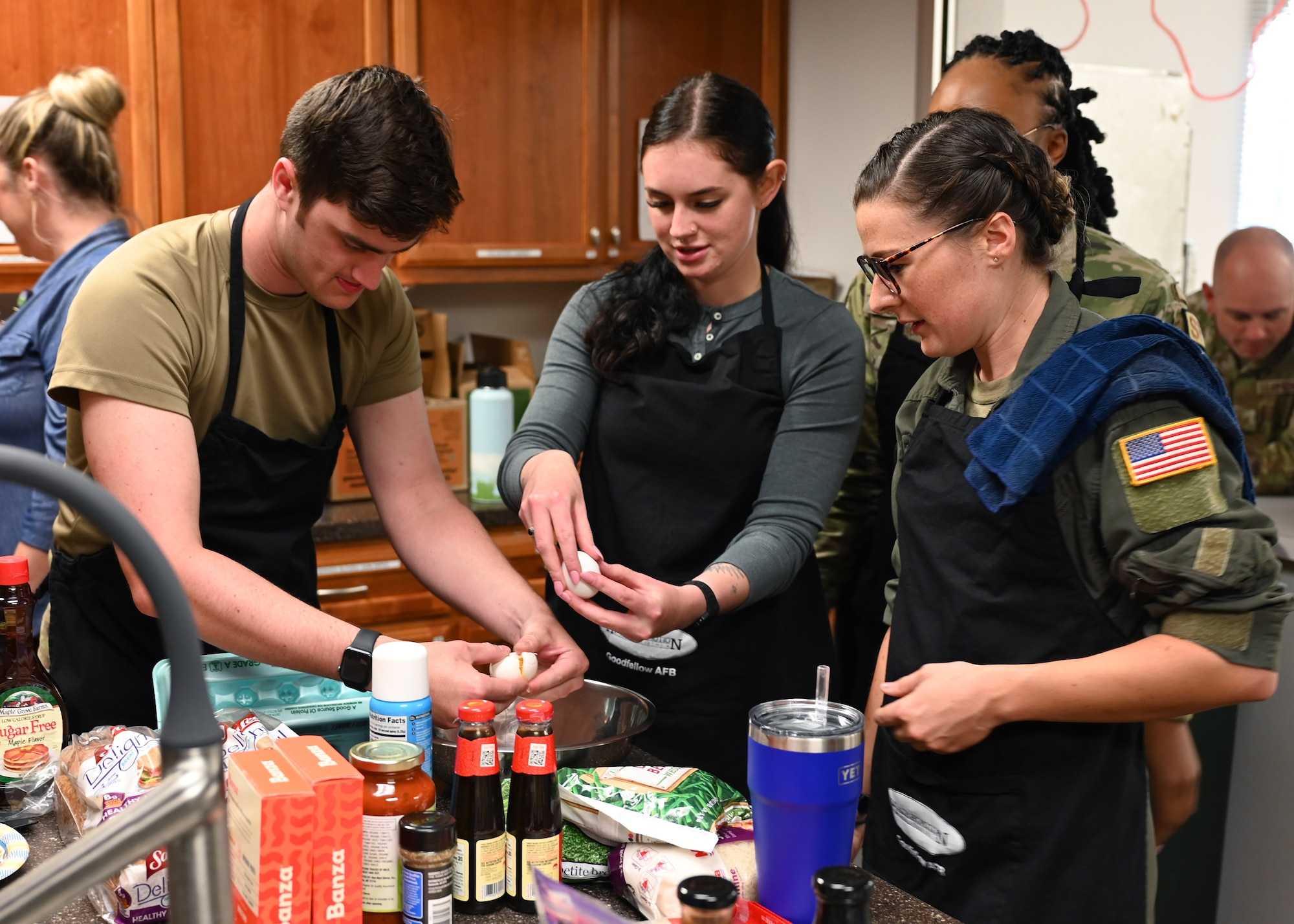 U.S. Air Force Capt. Molly Dunkelberger, 17th Medical Group aerospace nurse practitioner, leads a meal preparation class at Taylor Chapel, Goodfellow Air Force Base, Texas June 28, 2022. Dunkelberger held the class to teach members of the 17 SFS to live healthy lifestyles. (U.S. Air Force photo by 2nd Lt. Steve Garrett)