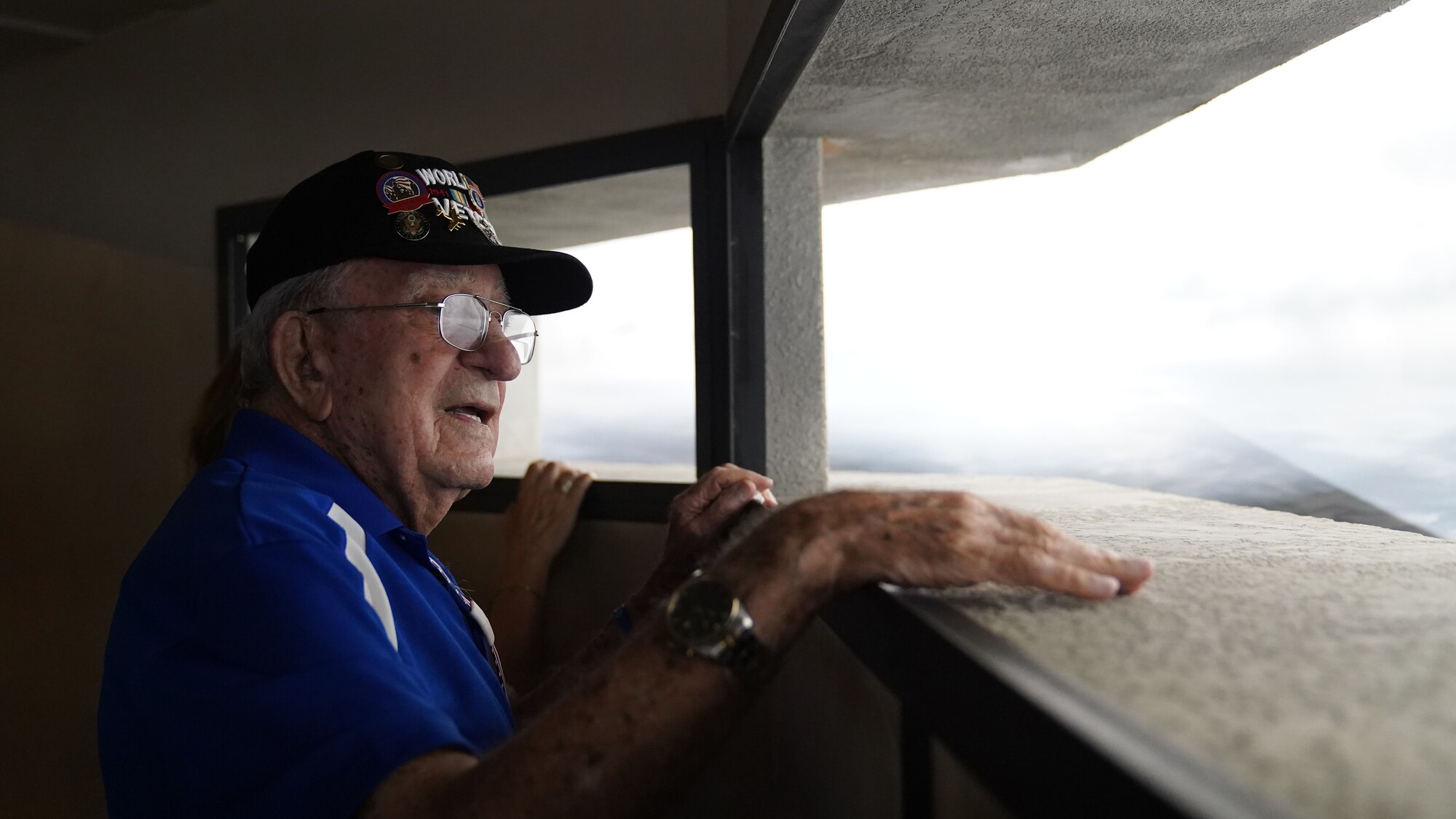 Retired U.S. Army Air Forces Chief Master Sgt. Mel Jenner, 452nd Bomber Group radio operator, stands in a replica of a D-Day bunker at the National World War II Museum, New Orleans, Louisiana, Sept. 14, 2022. Jenner flew over Normandy Beach on D-Day, June 6, 1944. He began his 26 year military career by training as a radio operator at what was then known as Keesler Army Airfield. (U.S. Air Force photo by Airman 1st Class Elizabeth Davis)
