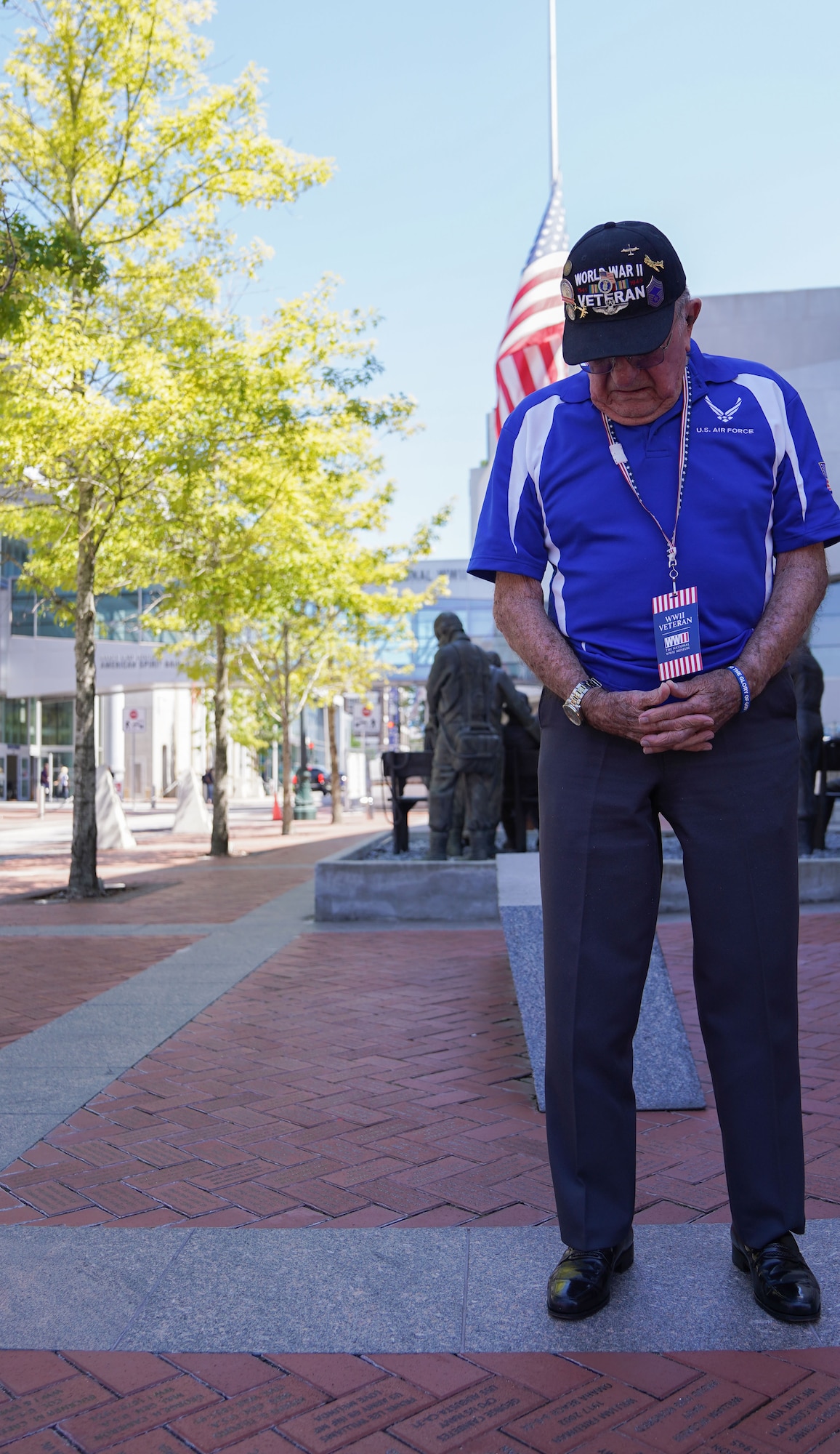 Retired U.S. Army Air Forces Chief Master Sgt. Mel Jenner, 452nd Bomber Group radio operator, looks down at his commemorative brick for the first time at the National World War II Museum, New Orleans, Louisiana, Sept. 14, 2022. Jenner’s late first wife purchased a commemorative brick to honor his military service. Jenner began his 26 year military career by training as a radio operator at what was then known as Keesler Army Airfield. (U.S. Air Force photo by Airman 1st Class Elizabeth Davis)