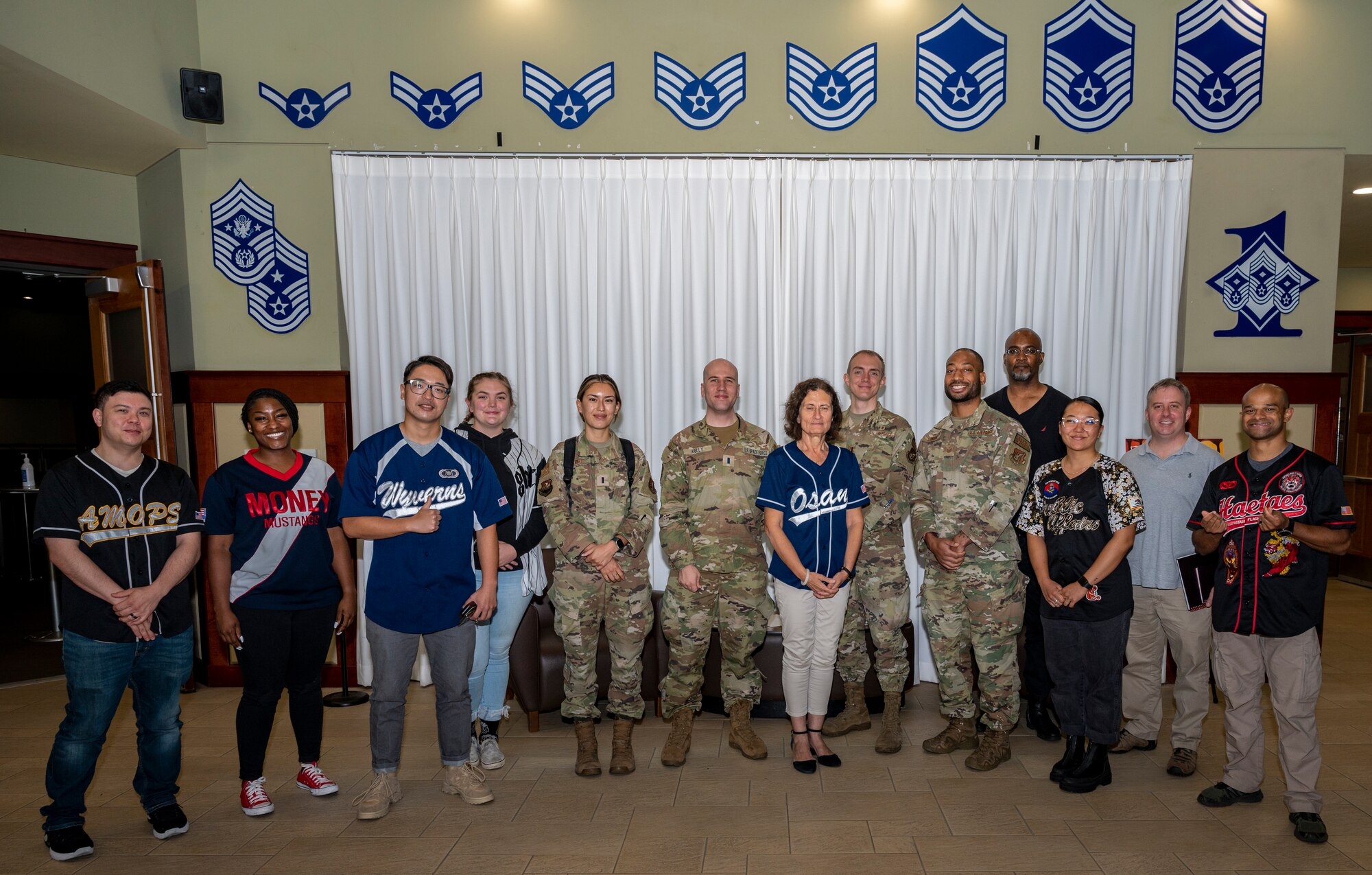 Dr. Victoria Coleman, U.S. Air Force Chief Scientist, poses for a photo with Airmen at Osan Air Base, Republic of Korea, Sept. 23, 2022.