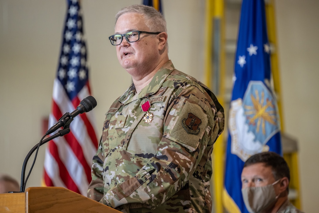 Brig. Gen. David J. Mounkes speaks to audience members during a promotion and change-of-command ceremony at the Kentucky Air National Guard Base in Louisville, Ky., Aug. 13, 2022 as Brig. Gen. Jeffrey L. Wilkinson looks on. Mounkes assumed command of the Kentucky Air Guard at the event, taking on the role of assistant adjutant general for Air from Wilkinson, who is retiring. (U.S. Air National Guard photo by Dale Greer)