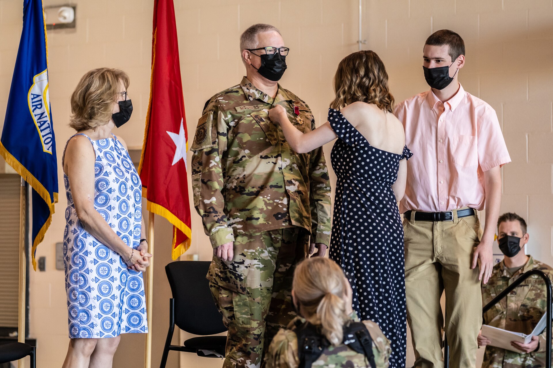 Family members of David J. Mounkes apply his new brigadier general officer rank during a promotion and change-of-command ceremony held at the Kentucky Air National Guard Base in Louisville, Ky., Aug. 13, 2022. Mounkes assumed command of the Kentucky Air Guard at the event, taking on the role of assistant adjutant general for Air from Brig. Gen. Jeffrey L. Wilkinson, who is retiring. (U.S. Air National Guard photo by Dale Greer)