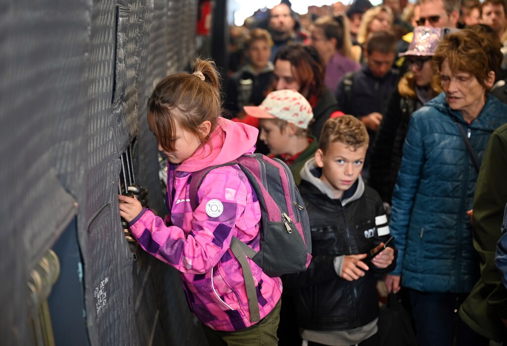 A young guest explores a C-5M Super Galaxy aircraft during the NATO Days air show in Ostrava, Czech Republic, Sept. 17, 2022. The C-5M was the largest aircraft on display during the two-day event. (U.S. Air Force photo by Staff Sgt. Monet Villacorte)