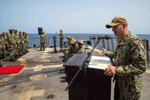 Cmdr. Sam Sareini, outgoing commanding officer of USS Nitze (DDG 94) gives remarks during a change of command ceremony in the Gulf of Aden, Sept. 28. Nitze is deployed to the U.S. 5th Fleet area of operations to help ensure maritime security and stability in the Middle East region.