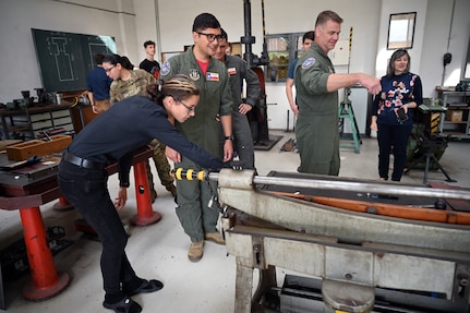 Students from the Secondary Vocational School Karvina, in Hranice, Czech Republic, give members of the 68th Airlift Squadron a tour of their hands-on classrooms Sept. 16. 2022. SPS is a technical school focused on engineering, information technology and electronics. (U.S. Air Force photo by Staff Sgt. Monet Villacorte)