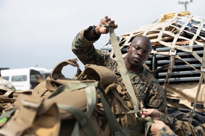 U.S. Marine Corps 1st Lt. Dayan Oduma, a communications officer with 3rd Marine Division, helps palletize gear in preparation to depart Okinawa, Japan during an Alert Contingency Marine Air-Ground Task Force drill, initiating the deployment of the division’s Forward Command Element participating in KAMANDAG 6 in the Philippines, Sept. 27, 2022. KAMANDAG is an annual bilateral exercise between the Armed Forces of the Philippines and U.S. military designed to strengthen interoperability, capabilities, trust, and cooperation built over decades of shared experiences. Oduma is a native of Compton, California.