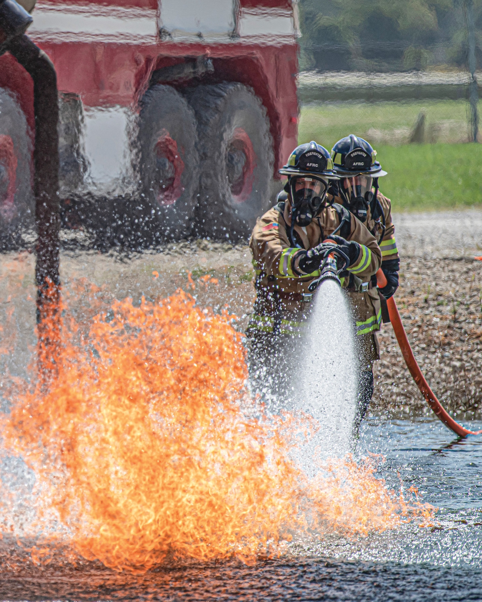 Staff Sgt. Ryan Guenther and Senior Airman Alex Walker, 445th Civil Engineering Squadron firefighters, put out an aircraft structural fire during live-fire training Sept. 9, 2022 at Wright-
Patterson Air Force Base, Ohio. Eight members of the 445th Civil Engineer Squadron fire and emergency services teamed up with the 788th Civil Engineer Squadron fire department for a live-fire training exercise, Sept. 9, 2022.