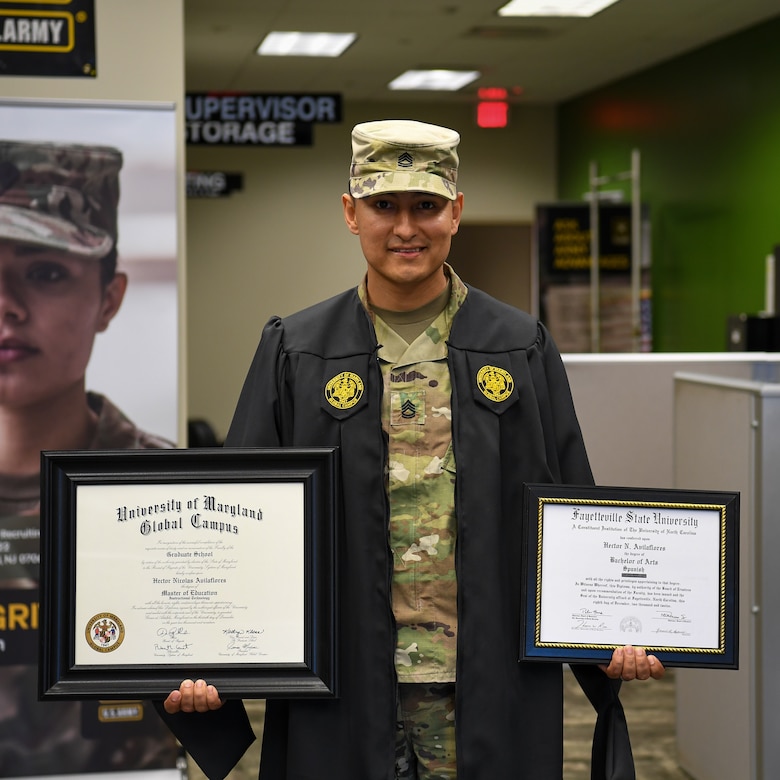 man in u.s. army uniform wearing a graduation gown.