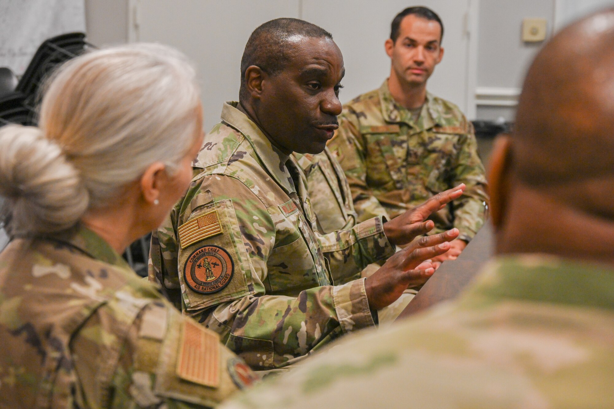 ANG command chief visits with other first sergeants.