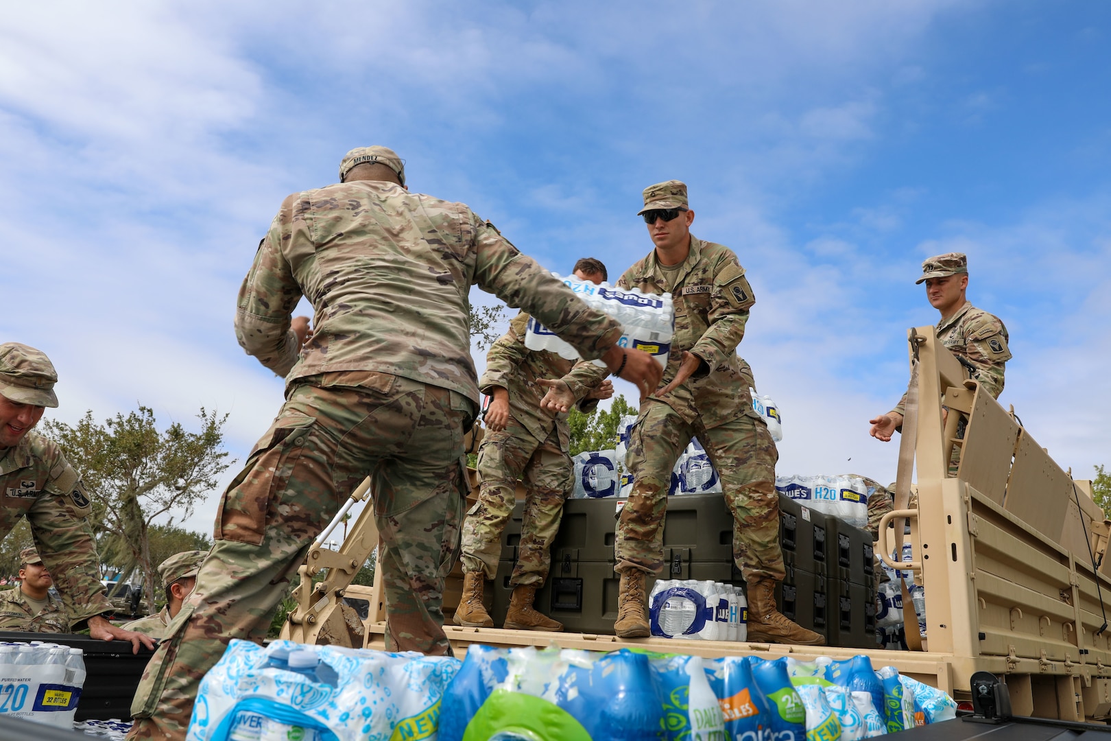 U.S. Army Soldiers with the Florida National Guard's Chemical, Biological, Radiological/Nuclear, and Explosive - Enhanced Response Force Package load supplies as part of their response to Hurricane Ian, Sarasota, Fla., Sept. 29, 2022. Soldiers and Airmen were joined by emergency responders from other states as they mobilized to support the local community.