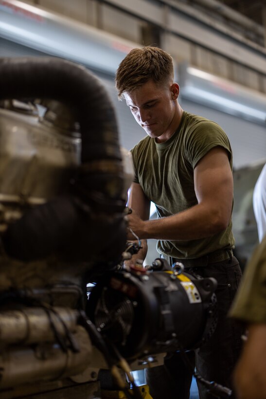 U.S. Marine Corps Cpl. Brendyn Franklin, a Brandon, Florida, native and a light armored vehicle technician with  2d Light Armored Reconnaissance Battalion, 2d Marine Division, performs maintenance on the engine of an LAV-25 on Camp Lejeune, North Carolina, Sept. 22, 2022. An LAV repairer/technician performs basic automotive duties and tasks incident to inspection, maintenance, and repair of the LAV family of vehicles. (U.S. Marine Corps photo by Lance Cpl. Ryan Ramsammy)