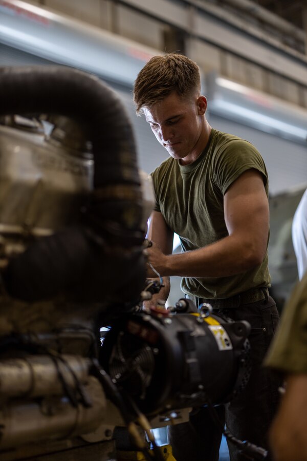 U.S. Marine Corps Cpl. Brendyn Franklin, a Brandon, Florida, native and a light armored vehicle technician with  2d Light Armored Reconnaissance Battalion, 2d Marine Division, performs maintenance on the engine of an LAV-25 on Camp Lejeune, North Carolina, Sept. 22, 2022.