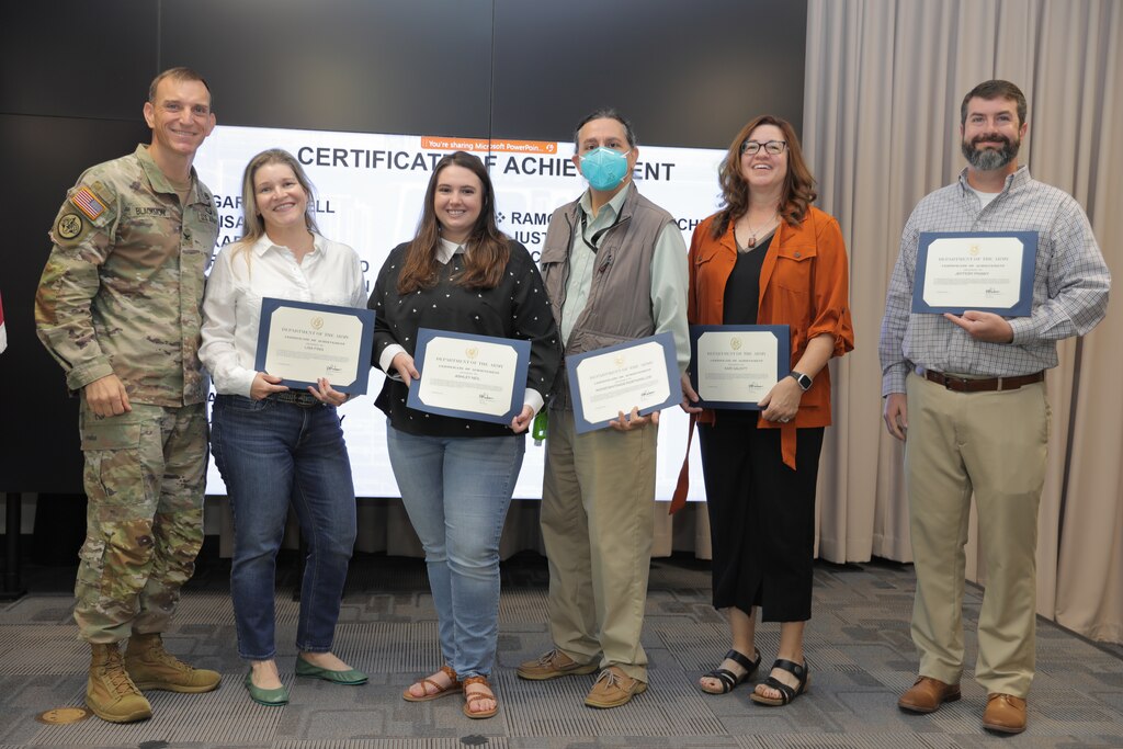 U.S. Army Corps of Engineers (USACE) Galveston District Commander Col. Rhett A. Blackmon (far left) awards the Matagorda Ship Channel Project Delivery Team with a group certificate of achievement during an award ceremony, September 29. 

(Starting second from left) Pictured are: Lisa Finn; Ashley Neil, Konstantinos Kostarelos; and Kari Gauntt. 

The team worked with the project's non-federal sponsor to design and provide oversight to improve navigation along the Matagorda Ship Channel.