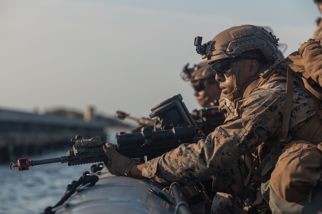 A U.S. Marine with 1st Battalion, 6th Marine Regiment, 2d Marine Division, aims his weapon during a tactical movement during a Marine Corps Combat Readiness Evaluation on Camp Lejeune, North Carolina, Sept. 26, 2022. A MCCRE is designed to evaluate and certify a unit's comprehensive warfighting ability as the most ready and lethal unit within the division. (U.S. Marine Corps photo by Lance Cpl. Megan Ozaki)