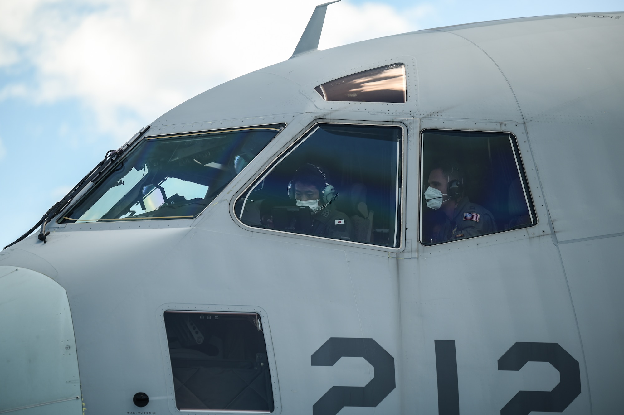 Japan Air Self-Defense Force and U.S. Pacific Air Forces Airmen perform pre-flight checks during bilateral training on a Kawasaki C-2 at Joint Base Pearl Harbor-Hickam, Hawaii, Sept. 26, 2022. The training was held to learn the capabilities and procedures of two different airlift airframes, learning best practices and techniques to utilize in future interoperable missions. (U.S. Air Force photo by Staff Sgt. Alan Ricker)