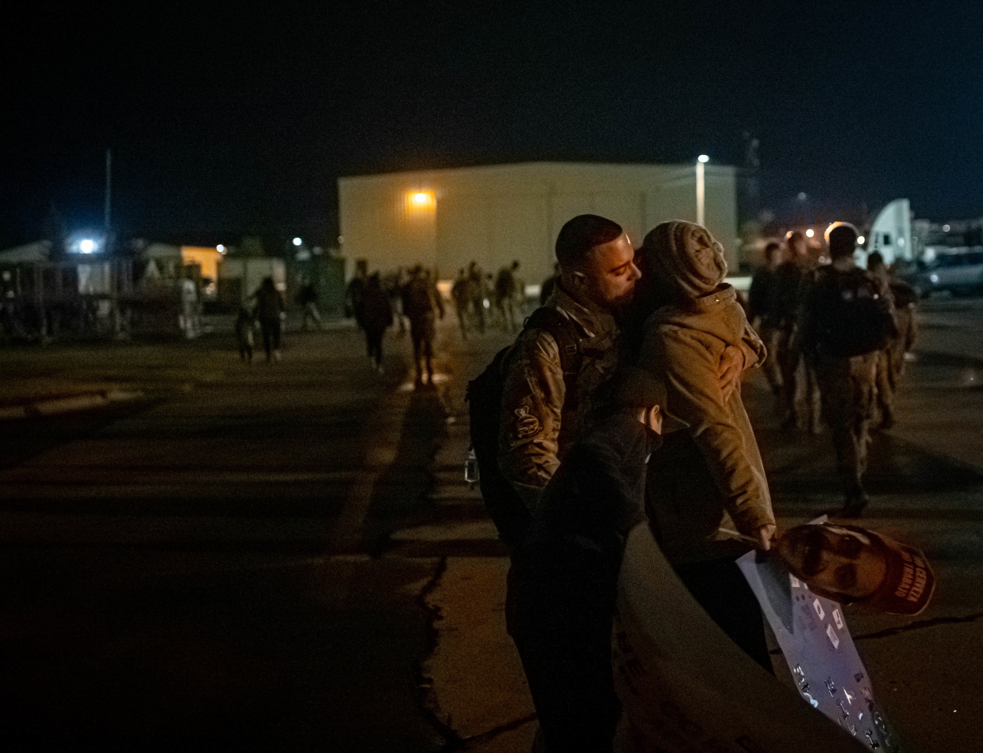 Airmen from the 23rd Expeditionary Bomb Squadron disembark a jet and are greeted by base leadership on the flightline at Minot Air Force Base, North Dakota, Sept. 24, 2022. The 23rd BS personnel were deployed to RAF Fairford, England in support of United States in Europe and Air Forces Africa command. (U.S. Air Force photo by Senior Airman Zachary Wright)