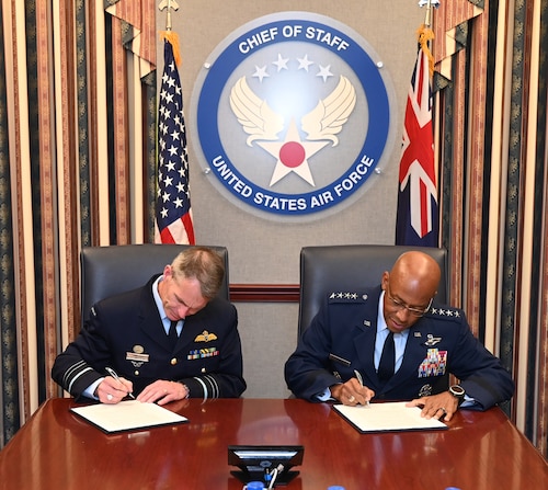 Air Force Chief of Staff Gen. CQ Brown, Jr., and Royal Australian Air Force Air Marshal Rob Chipman sign a Joint Vision Statement, Pentagon, Arlington, Va., Sept 14, 2022.. (U.S. Air Force photo by Andy Morataya)