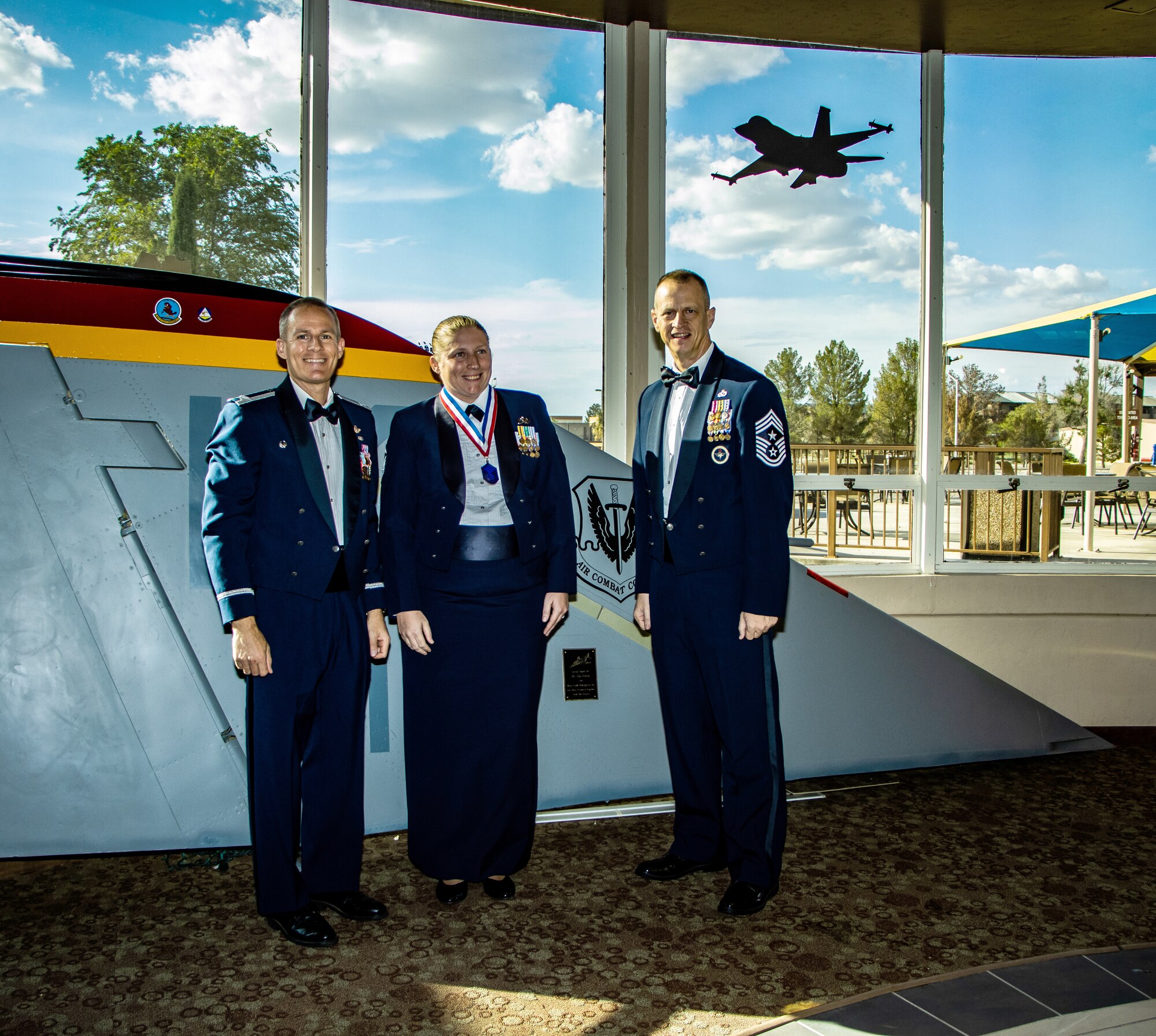 Master Sgt. Ida Rice, center, is inducted into the senior non-commissioned officer tier during an Aug. 26, 2022, ceremony at Holloman Air Force Base, New Mexico. Rice, a member of the 846th Test Squadron at Holloman, was selected to master sergeant in November 2021. The top three ranks of the enlisted force structure are chief master sergeant, senior master sergeant and master sergeant. Within this tier, personnel transition from craftsmen and supervisors to leadership and managerial positions. The purpose of the Senior Non-Commissioned Officer Induction Ceremony is to formally recognize Airmen as they transition from the non-commissioned officer tier to the senior non-commissioned officer tier and to afford leadership, peers and family the opportunity to celebrate their accomplishment. The mission of the 846 TS is to plan and execute world-class rocket sled tests enabling weapon system development in support of the warfighter. The squadron is part of the 704th Test Group at Holloman, a unit of Arnold Engineering Development Complex, headquartered at Arnold Air Force Base, Tennessee. Pictured with Rice are Col. Justin Spears, commander, 49th Wing, Holloman AFB, left, and Chief Master Sgt. Jeffrey Martin, command chief, 49th Wing. (Courtesy photos)