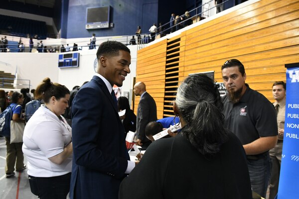 Chief of Civil Design Phillip Evans and Business Integration Chief Danita Jones speak with a job seeker about his future career expectations during the Tennessee State University career fair, in Nashville Tennessee.