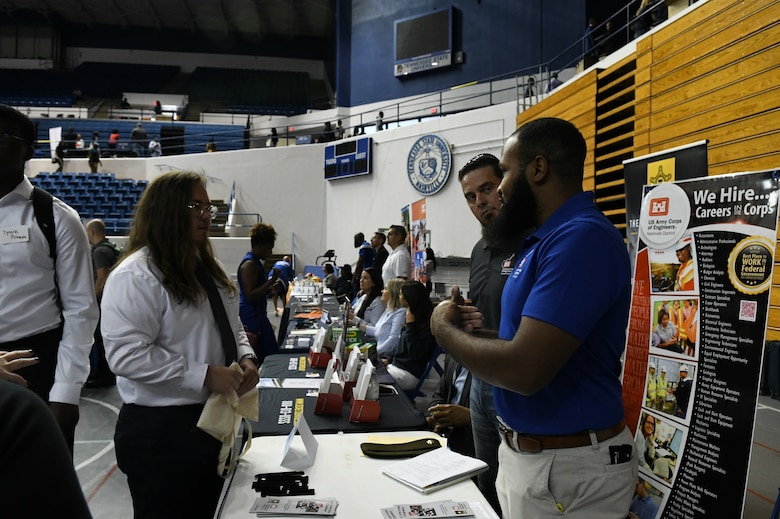 Civil Engineer Christopher Stewart shares the benefits of working for a federal agency with a job seeker at the Tennessee State University Career Fair in Nashville, Tennessee.
