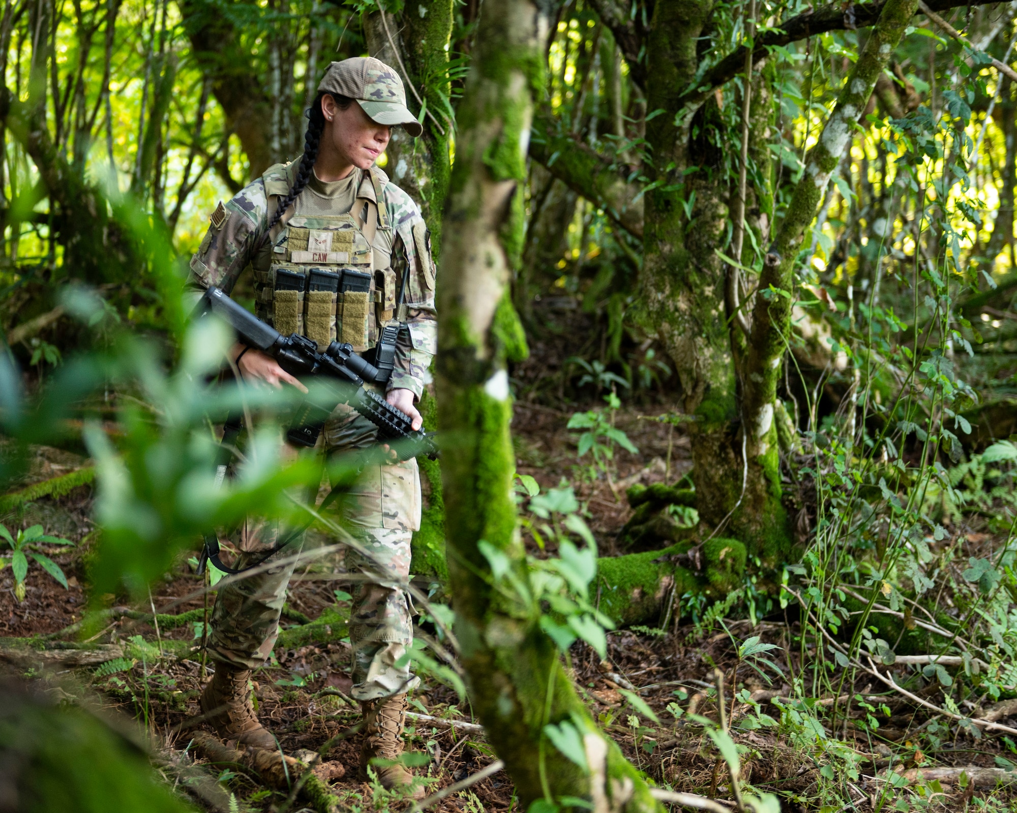 U.S. Air Force Airman 1st Class Avery Caw, 36th Security Forces Squadron fire team member, does a perimeter check on foot at Andersen Air Force Base Guam, Sep. 22, 2022. The Jungle Enforcement Team spends about eight hours a day patrolling the jungle looking for tracks, shotgun shells, dead carcasses, trash or people trespassing. (U.S. Air Force photo by Airman Spencer Perkins)