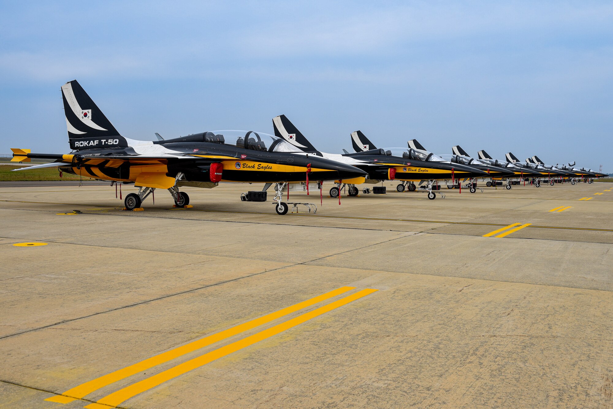 Republic of Korea (ROK) Air Force KAI T-50 Golden Eagles assigned to the 53rd Air Demonstration Group, “Black Eagles”, sit on the runway at Kunsan Air Base, ROK, Sept. 28, 2022. The ROK Air Force aerobatic team operates at various occasions to include air shows and national ceremonies. (U.S. Air Force photo by Tech. Sgt. Timothy Dischinat)