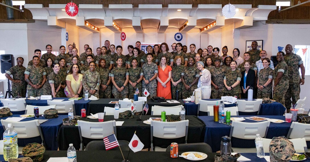 Service members across Okinawa pose for a group photo during the Women’s Leadership and Education Forum on Camp Schwab, Okinawa, Japan, Sept. 22, 2022. WLEF provided an opportunity for networking, mentorship, education, and peer-to-peer collaboration among male and female service members. (U.S. Marine Corps photo by Lance Cpl. Jonathan Beauchamp)