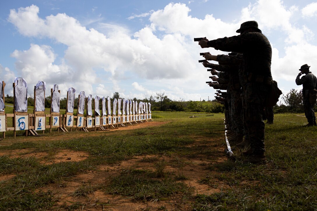 U.S. Marines with 9th Engineer Support Battalion, 3rd Marine Logistics Group, fire at their targets during a pistol qualification on Camp Hansen, Okinawa, Japan, Sept. 23, 2022. The 9th ESB Shooting Team Competition and Tryouts was a four-day event that involved firing the M110 Semi-Automatic Sniper System, M18 service pistol, and the M16A4 assault rifle in timed events to test speed and accuracy. The event’s top performers will compete in the Far East Shooting Competition scheduled in December. (U.S. Marine Corps photo by Lance Cpl. Thomas Sheng)