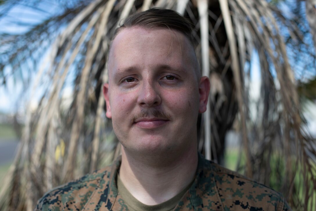 U.S. Marine Corps Cpl. Austin Reichel, a radio non-commissioned officer with Headquarters Battalion, Marine Corps Base Hawaii, poses for a photo, MCBH, Sep. 26, 2022. Reichel will receive the Navy and Marine Corps Achievement Medal for his actions at Waimano Falls, July 5, 2021. Reichel assisted a woman who had sustained injuries while hiking, until she was airlifted by paramedics. (U.S. Marine Corps photo by Lance Cpl. Isaiah Hill)
