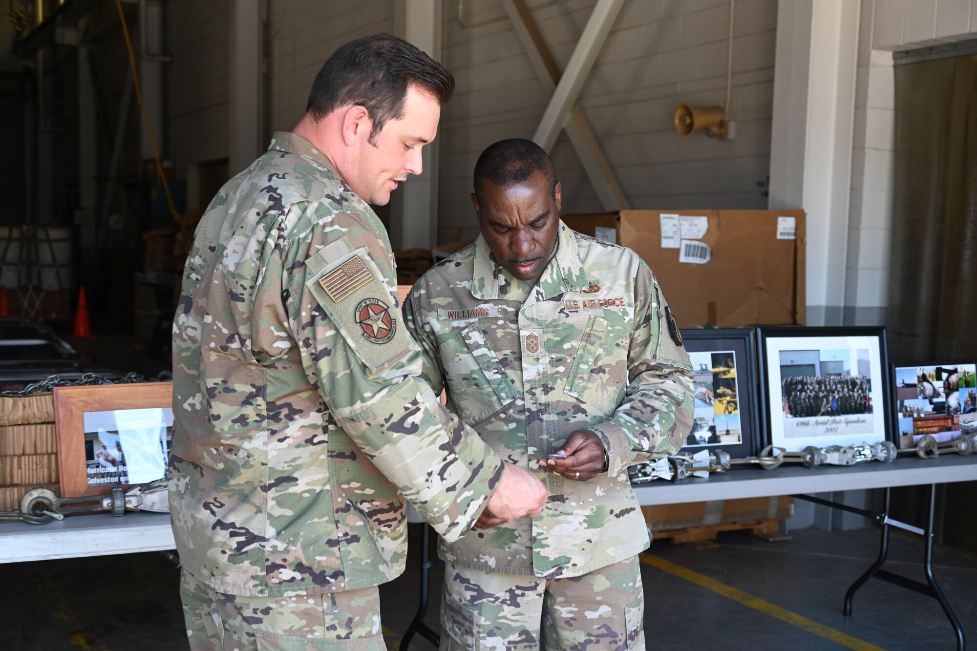 Airmen presents a patch to ANG command chief.