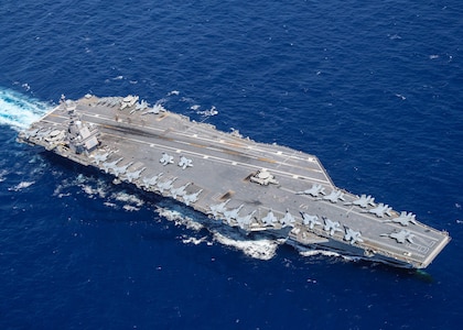 ATLANTIC OCEAN - Aircraft attached to Carrier Air Wing (CVW) 8 sit on USS Gerald R. Ford's (CVN 78) flight deck as the ship steams through the Atlantic Ocean, April 13, 2022. Ford is underway conducting carrier qualifications and strike group integration prior to operational deployment. (U.S. Navy photo by Mass Communication Specialist 2nd Class Riley McDowell)