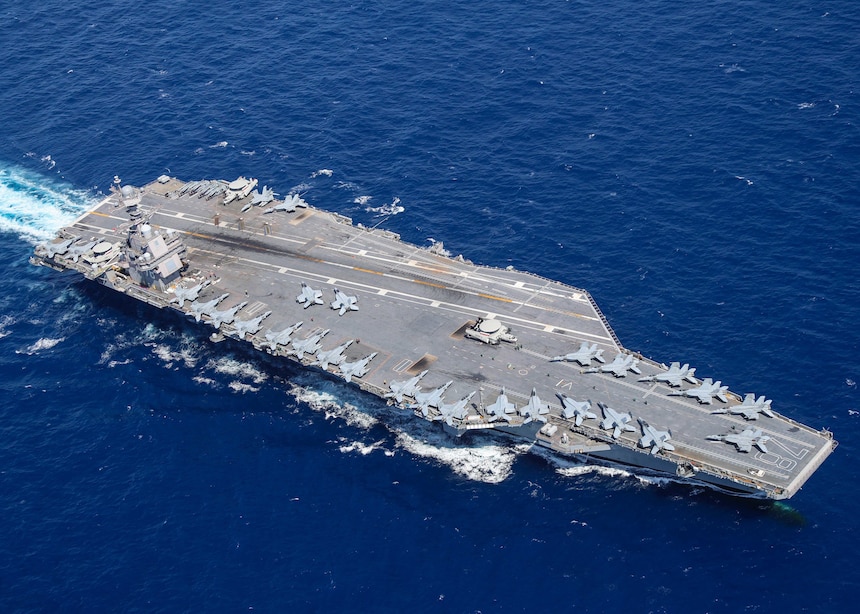 ATLANTIC OCEAN - Aircraft attached to Carrier Air Wing (CVW) 8 sit on USS Gerald R. Ford's (CVN 78) flight deck as the ship steams through the Atlantic Ocean, April 13, 2022. Ford is underway conducting carrier qualifications and strike group integration prior to operational deployment. (U.S. Navy photo by Mass Communication Specialist 2nd Class Riley McDowell)