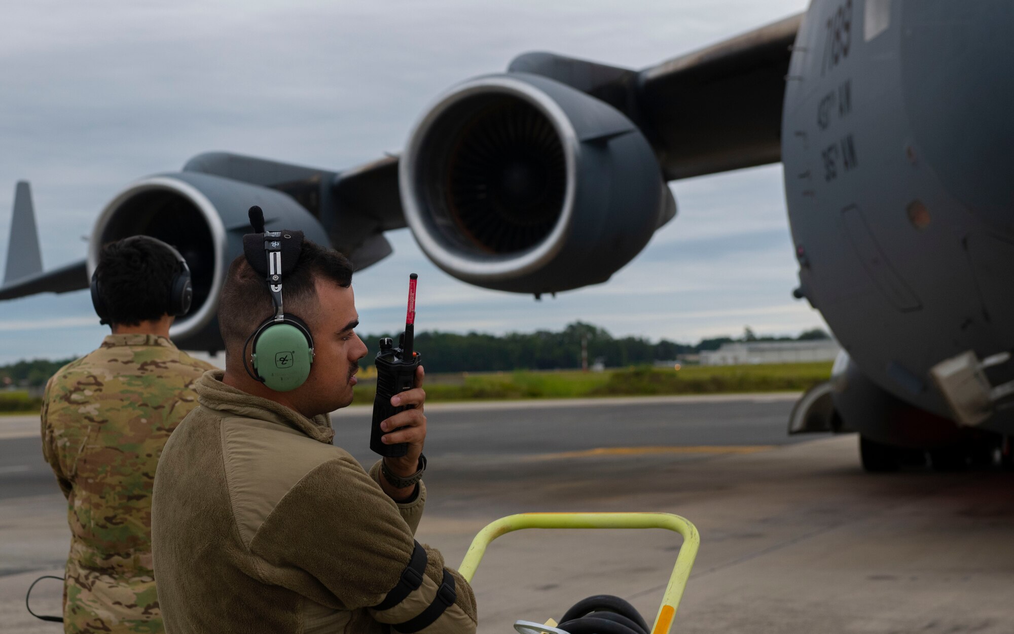 An Airmen talks into a radio.