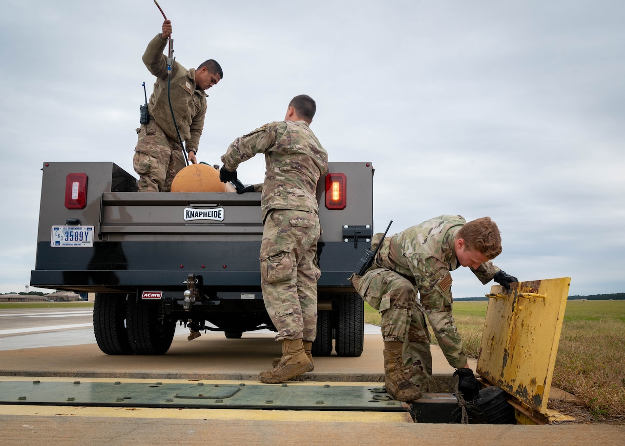 Picture of CES Airmen prepping for Tropical Storm Ian