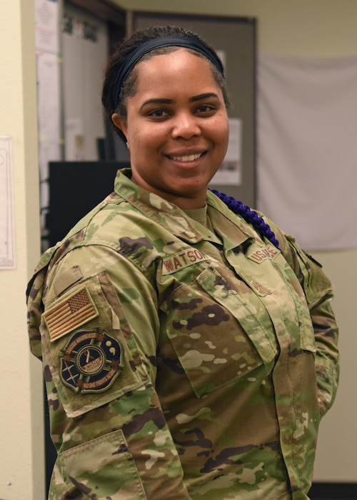 U.S. Air Force Staff Sgt. Erika Watson, 17th Medical Group commander support staff noncommissioned officer in charge, shows off her suicide awareness patch at the Ross Clinic, Goodfellow Air Force Base, Texas, Sept. 8, 2022. The medical career field’s goal is to keep Airmen ‘fit to fight,’ which also encompasses mental health. (U.S. Air Force photo by Senior Airman Ethan Sherwood)