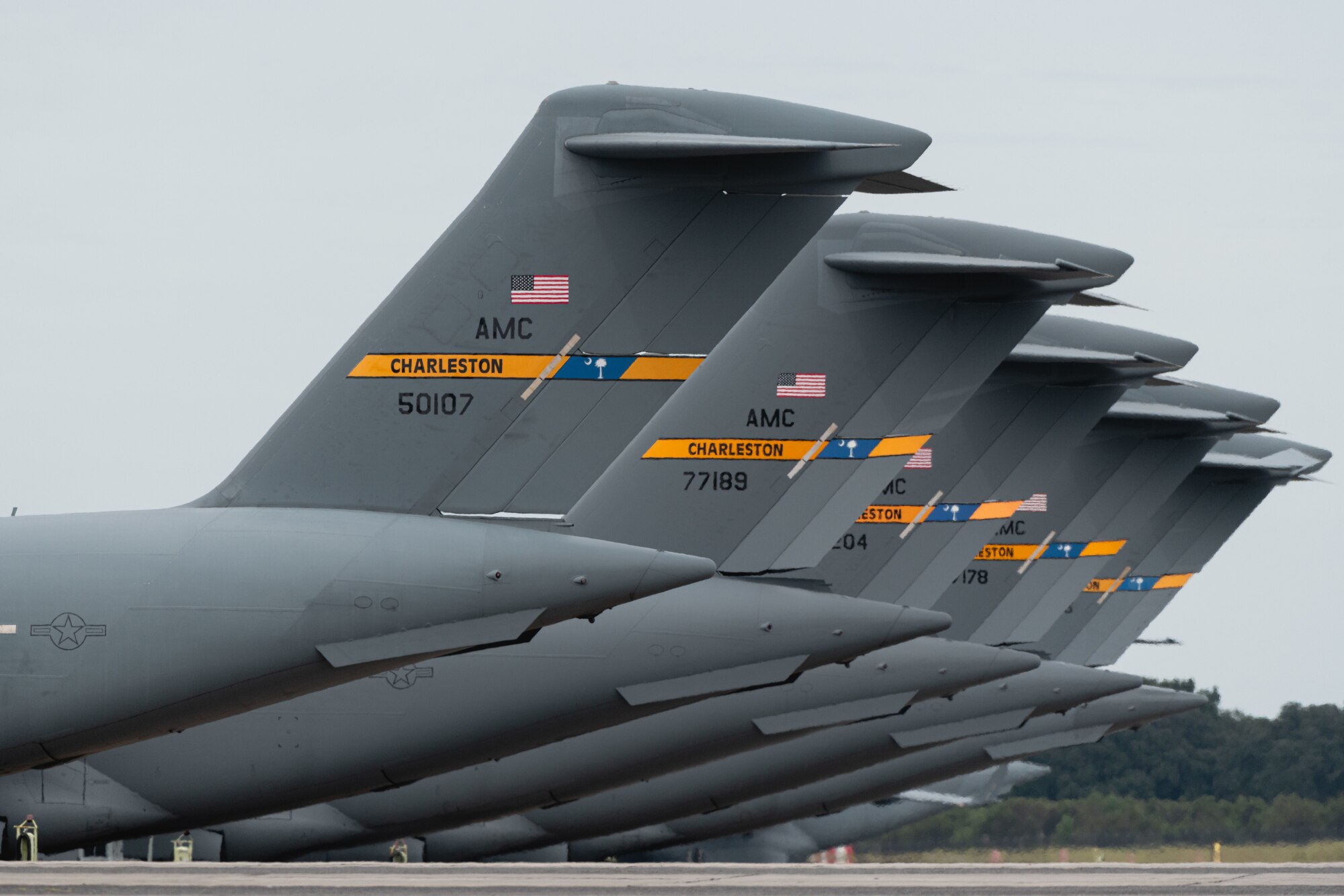 Multiple aircraft sit on the flightline.