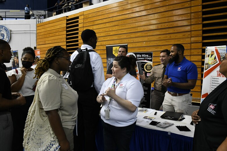 Supervisory Human Resources Specialist Rebecca Huberman shares a list of potential jobs with a job seeker who stopped by the Corps of Engineers recruiting table at the TSU career fair in Nashville, Tennessee.