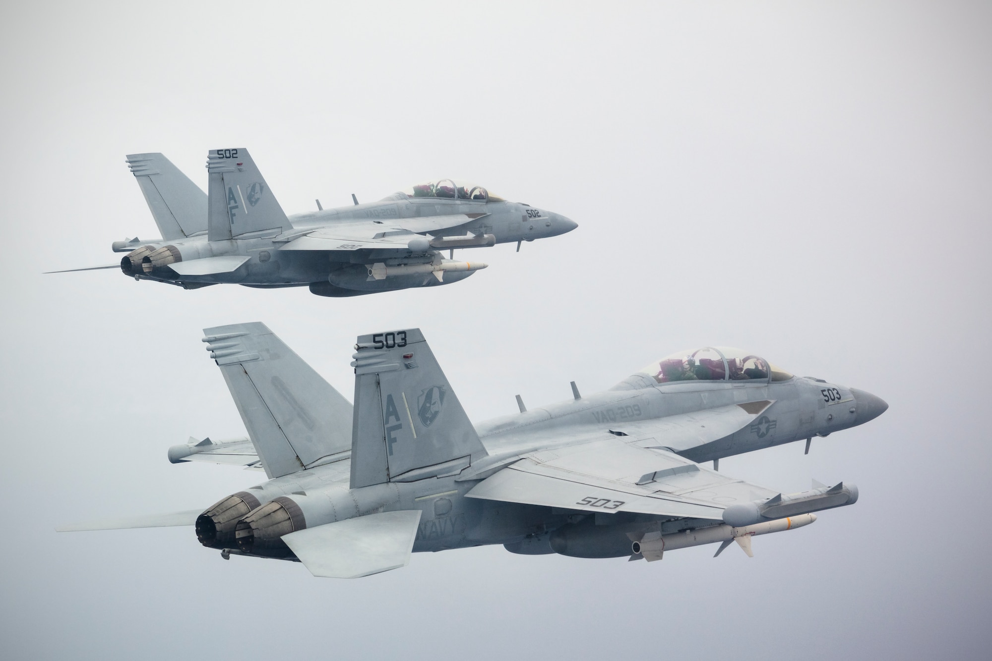 EA-18G Growlers from the "Star Warriors" of Electronic Attack Squadron (VAQ) 209 simultaneously fire two AGM-88 High Speed Anti-Radiation Missiles (HARM) during a training exercise near Guam. The AGM-88 HARM is a tactical air-to-surface missile which finds and destroys threat radar air defense systems. Supporting a free and open Indo-Pacific and operating out of Andersen Air Force Base on the "Forward Edge" while utilizing the Marianas Islands Range Complex, VAQ-209's live-fire exercise provided valuable training to ordnance personnel and aircrew alike. As the US Military's only Reserve EA-18G squadron, VAQ-209 is currently forward deployed to Japan and operating across the Indo-Pacific as the expeditionary VAQ squadron currently assigned to Commander, Task Force (CTF) 70. (U.S. Navy photo by Cmdr. Peter Scheu)