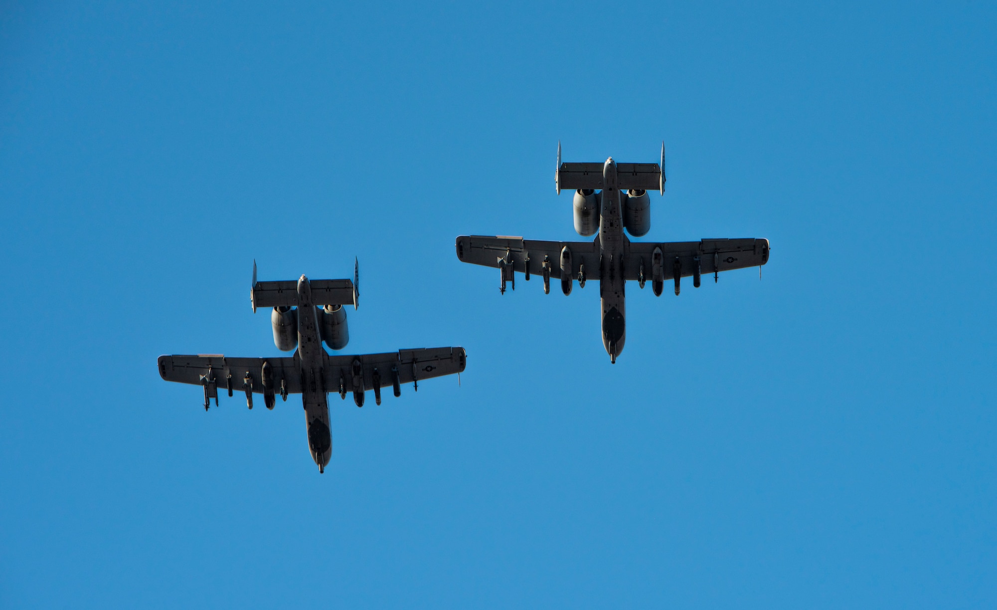 Two A-10 Thunderbolt II’s assigned to the 25th Fighter Squadron fly in formation over a POW/MIA remembrance ceremony at Osan Air Base, Republic of Korea, Sept. 27, 2022.