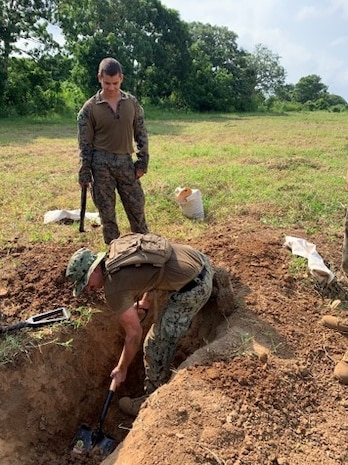 Seabees and Marine Engineers work together to perform tests on the soil for the DNK Mobile Training Campsite.