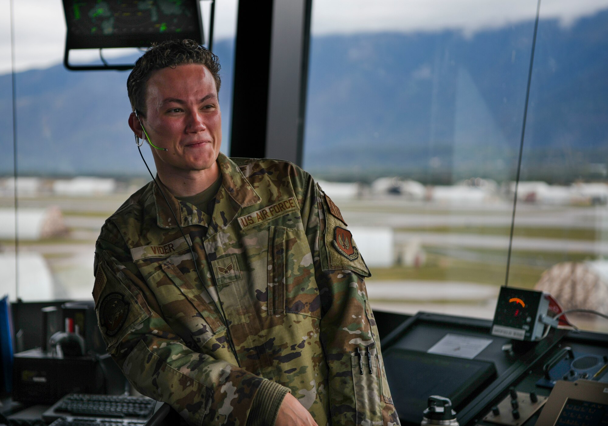 Senior Airmen Nicolas Vider looks out through air traffic control tower’s windows during his shift